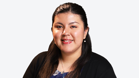 Pearl Escobar smiling in front of a white background
