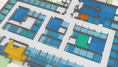 3D floor plan visualization of a large building, showing rooms, corridors, and open spaces in various shades of blue, white, and beige with a green area outside.