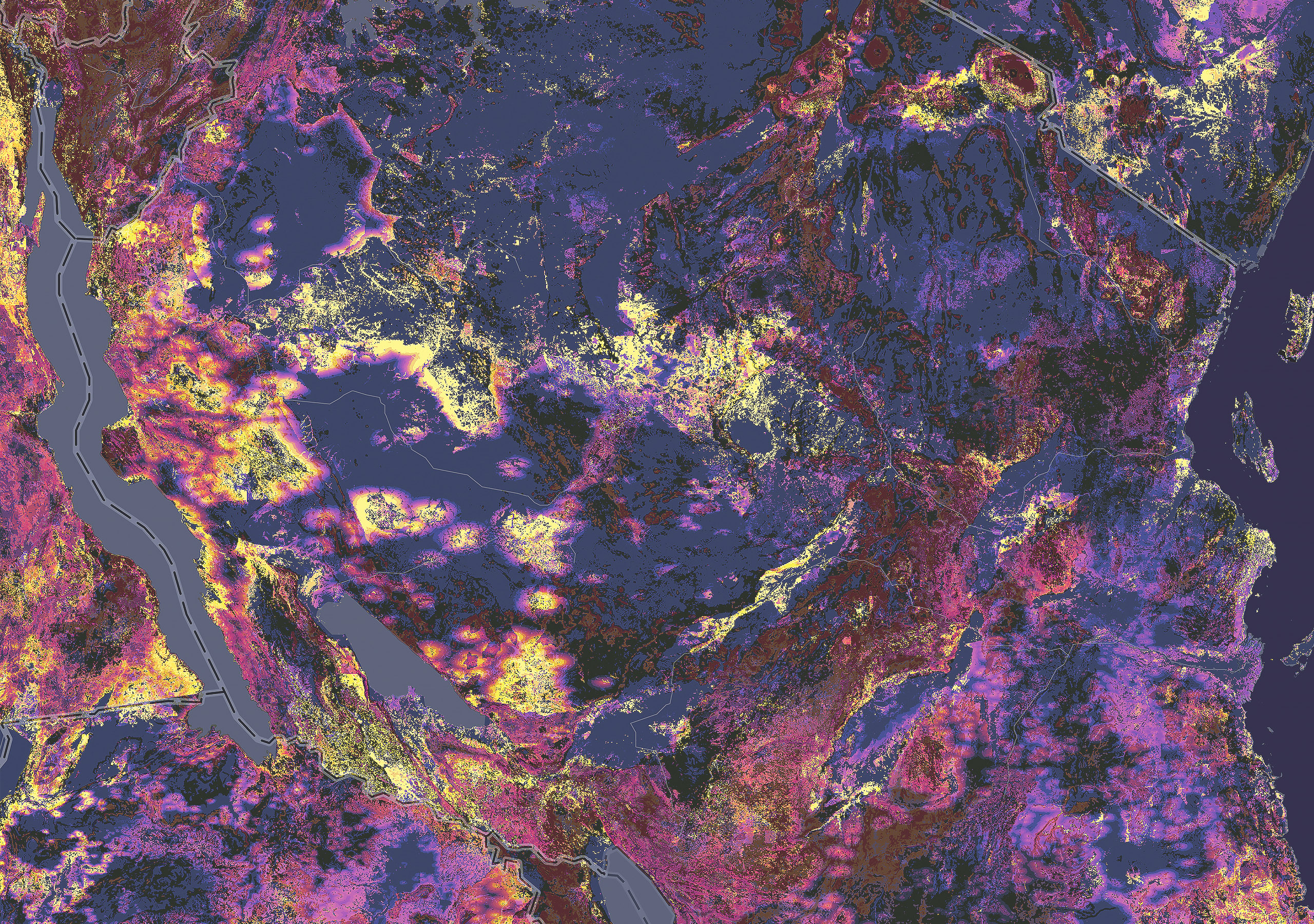 A map of a coastline shows remote sensing data about nearby terrain in shades of purple, brown, maroon, pink, and yellow
