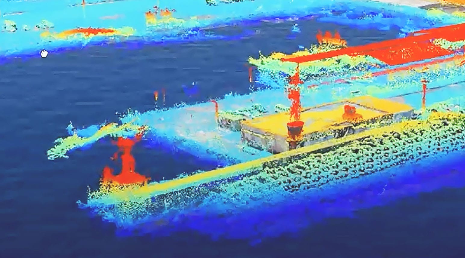 A drone image shows remote sensing data in a dark blue, light blue, yellow, and red gradient