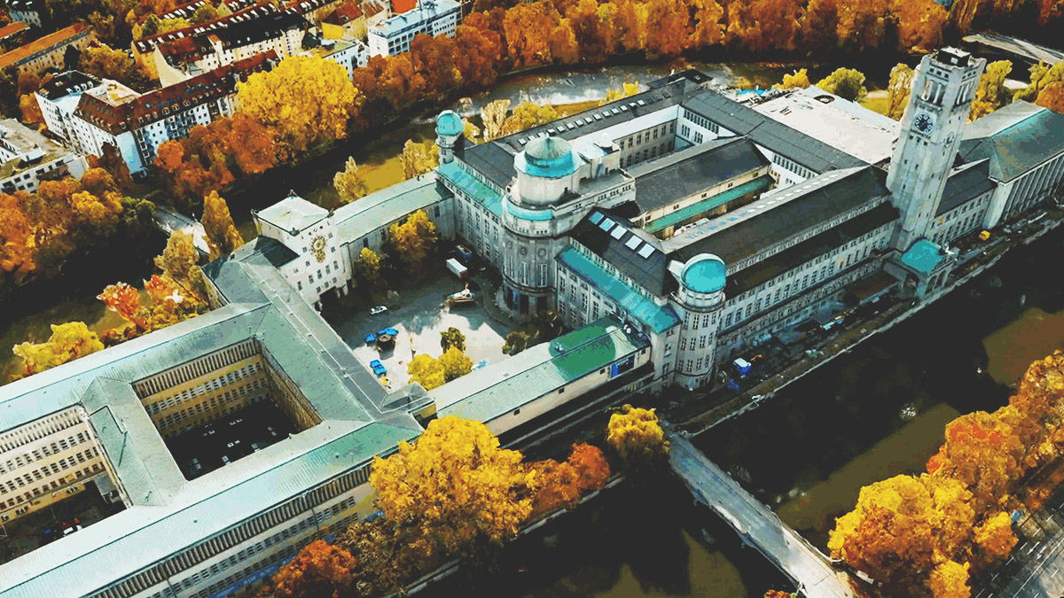 Off-nadir imagery of a large government building surrounded by trees with yellow and orange leaves