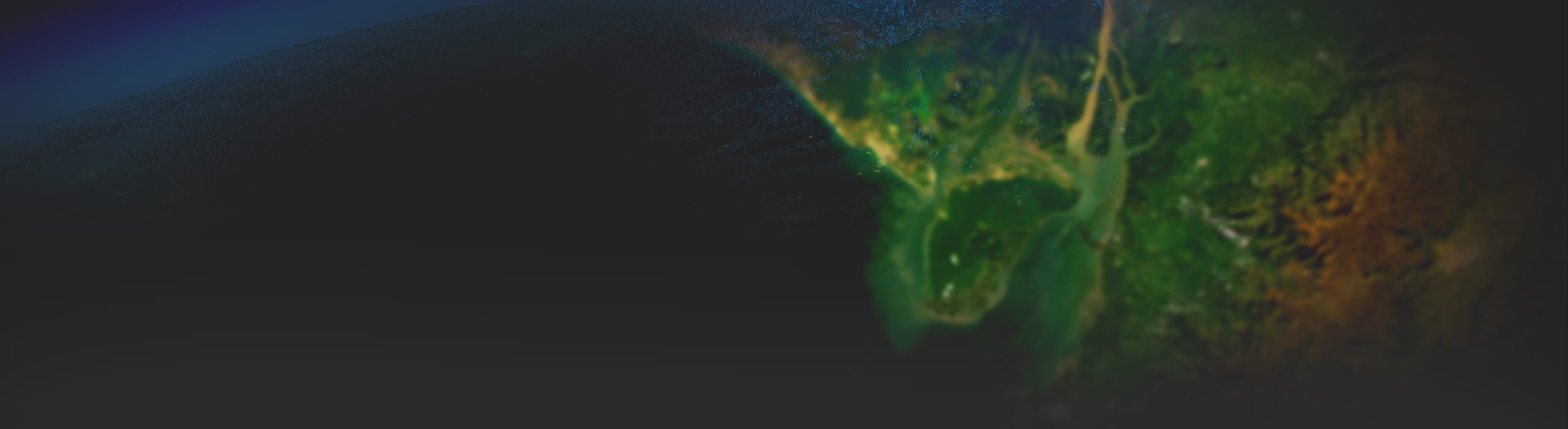 A black background fades into a satellite image of a green coastal landscape