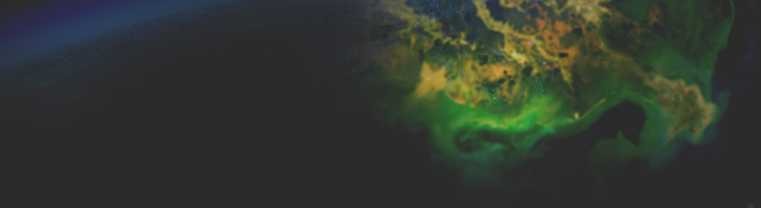 A black background fades into a satellite image of a green coastal landscape