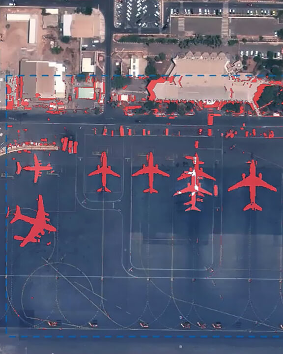 an airport image and red airplanes showing change detection