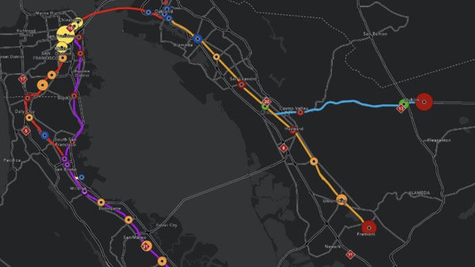 A black colored map of public transit in San Francisco and Oakland with routes highlighted in yellow and purple