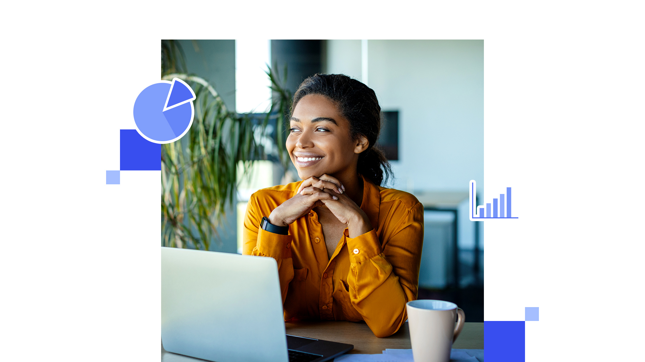 Smiling, dark-haired person holds a piece of paper while using a laptop