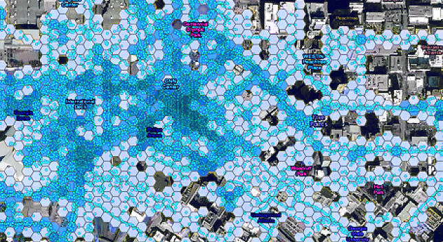 Map of a city with hexagons overlaid in varying shades of blue 
