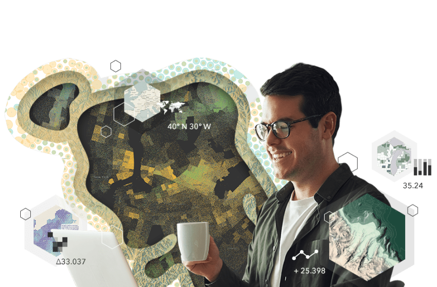 A person holding a coffee mug and looking at a laptop screen overlaid on a graphic parcel map shaded in greens and several other maps