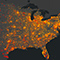 A concentration map of the United States in dark gray scattered with yellow, red, and orange map point clusters