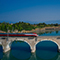 A high speed train passing on a railway bridge over Lake Garda in Italy