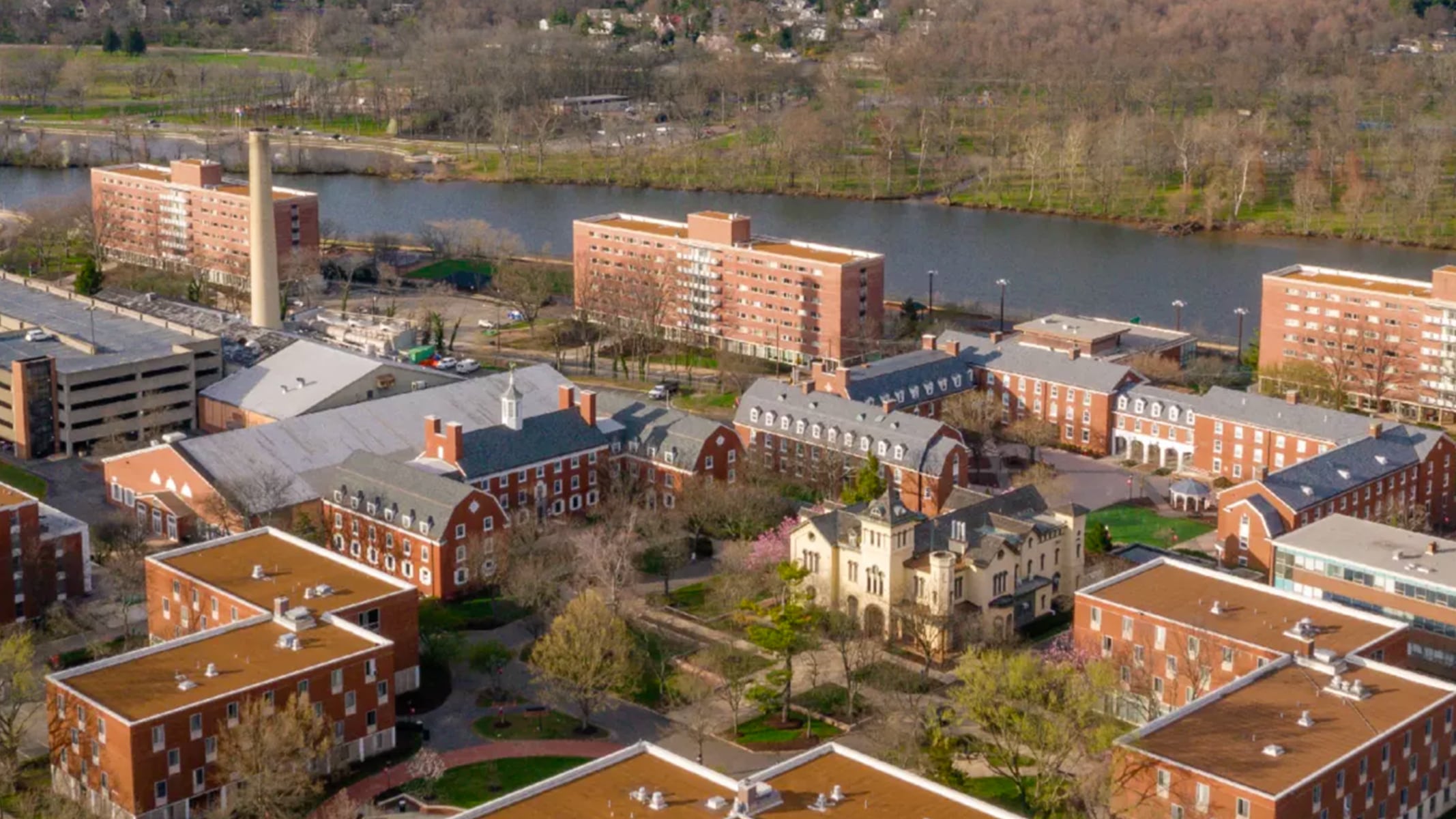 Aerial view of Rutgers University showing brick buildings along a river