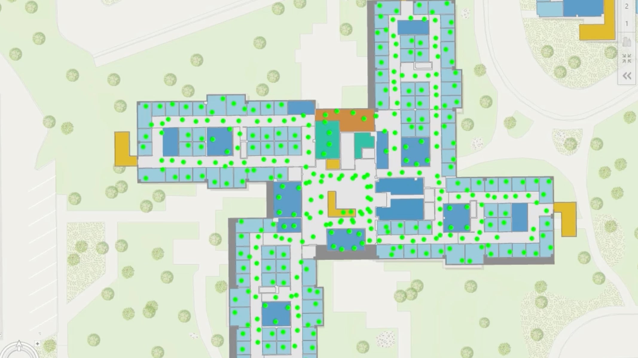 Building floor plan showing numerous green dots over hallways, common areas, and offices.