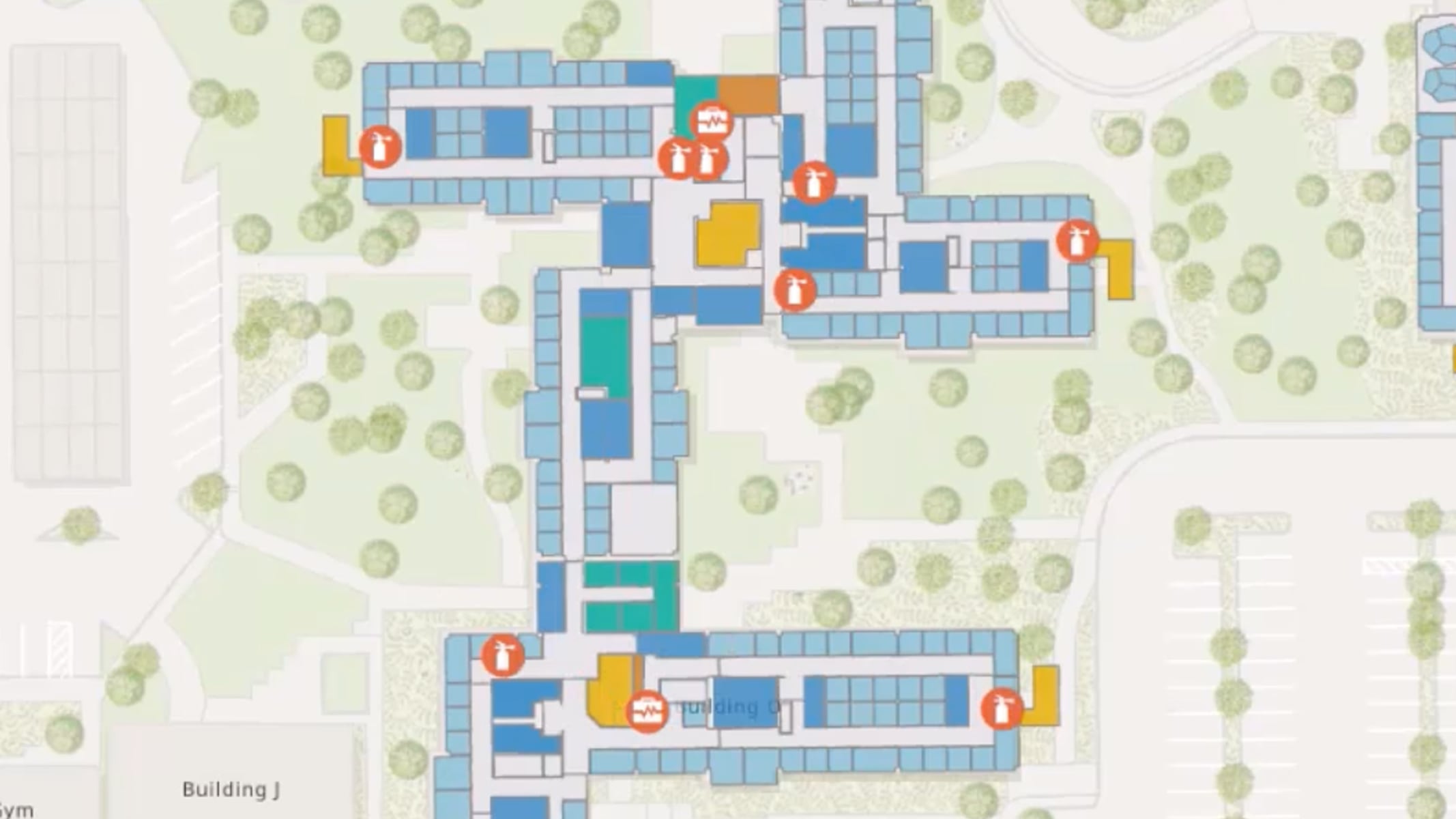 Building floor plan showing icons for fire extinguishers and medical equipment.