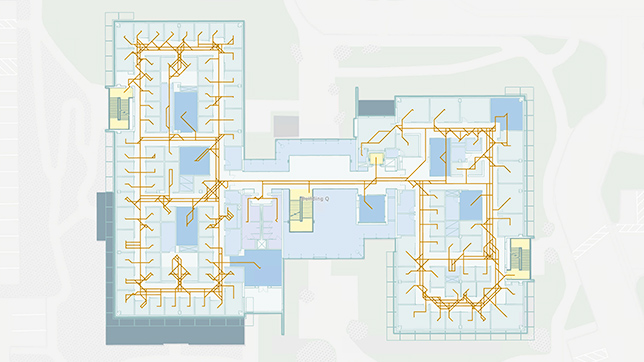 Indoor map of an office building with orange routing networks showing possible navigation routes