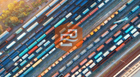 An aerial view of a train hard filled with rows of boxcars, overlaid with the ArcGIS Insights logo
