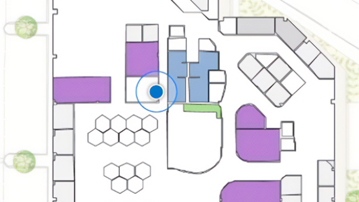 A map showing the indoors of an office with a blue dot, purple rectangles, and squares 