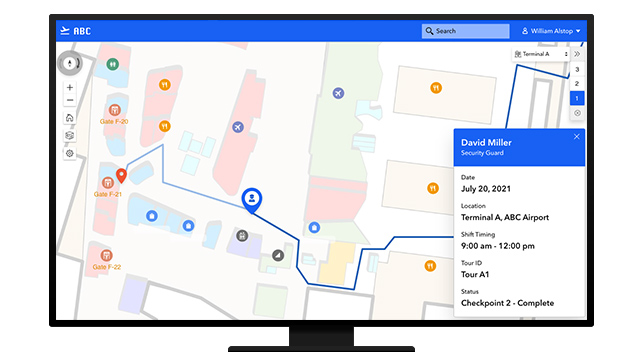 Wysoki, nowoczesny budynek biurowy z nałożonym ekranem dotykowym telefonu, na którym widać oprogramowanie do tworzenia map wnętrz