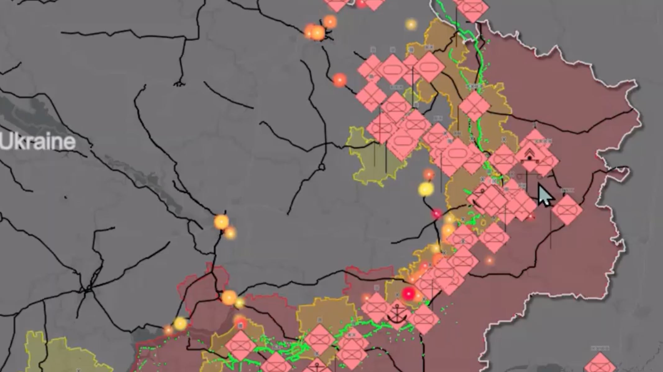 A gray map with red and green polygon overlays and glowing yellow points, indicating battlefield situational data, overlaid with a play button