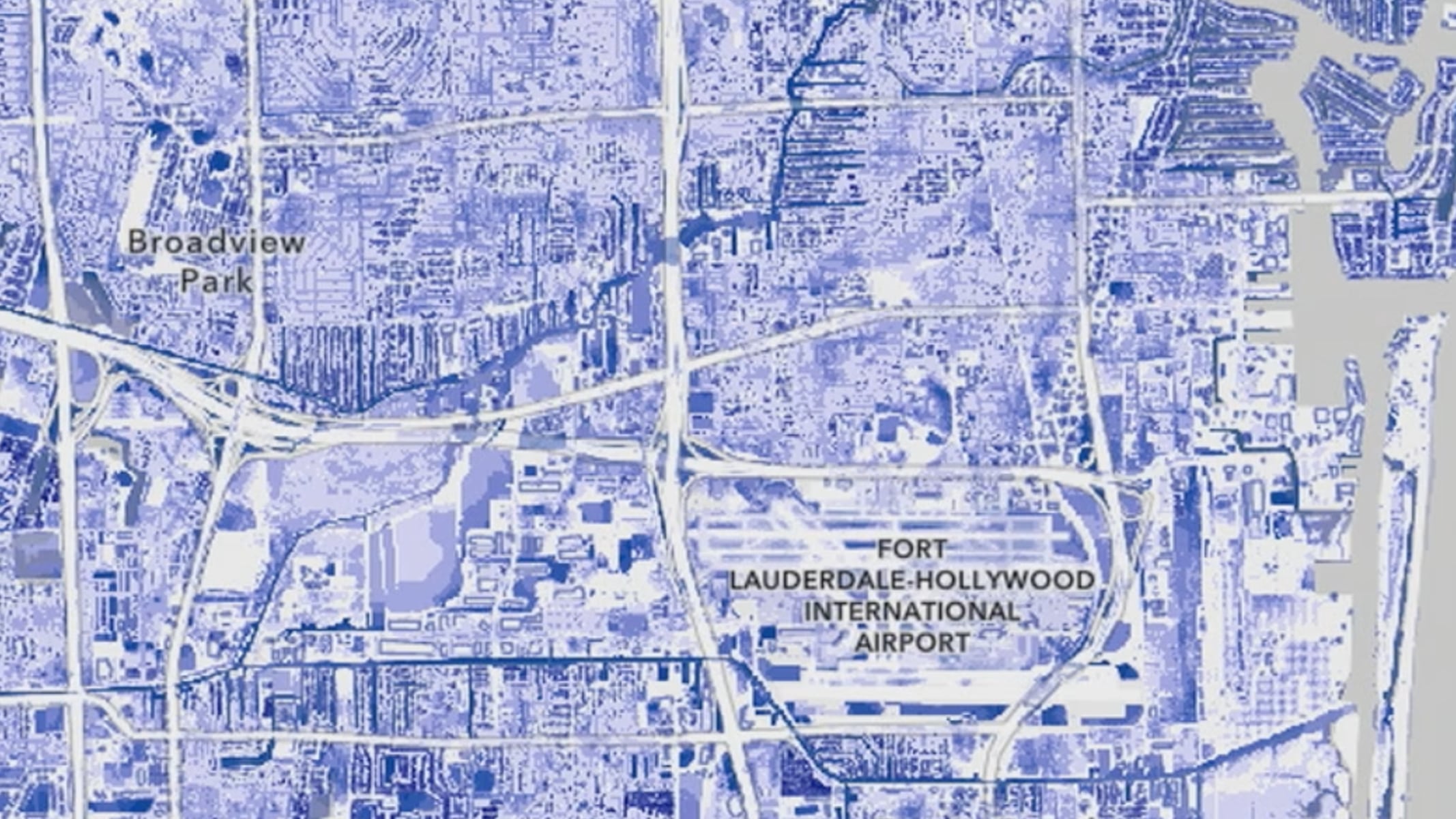 A blue-toned map showing detailed street layout and infrastructure, including labels for Broadview Park and Fort Lauderdale-Hollywood International Airport overlaid with a play button