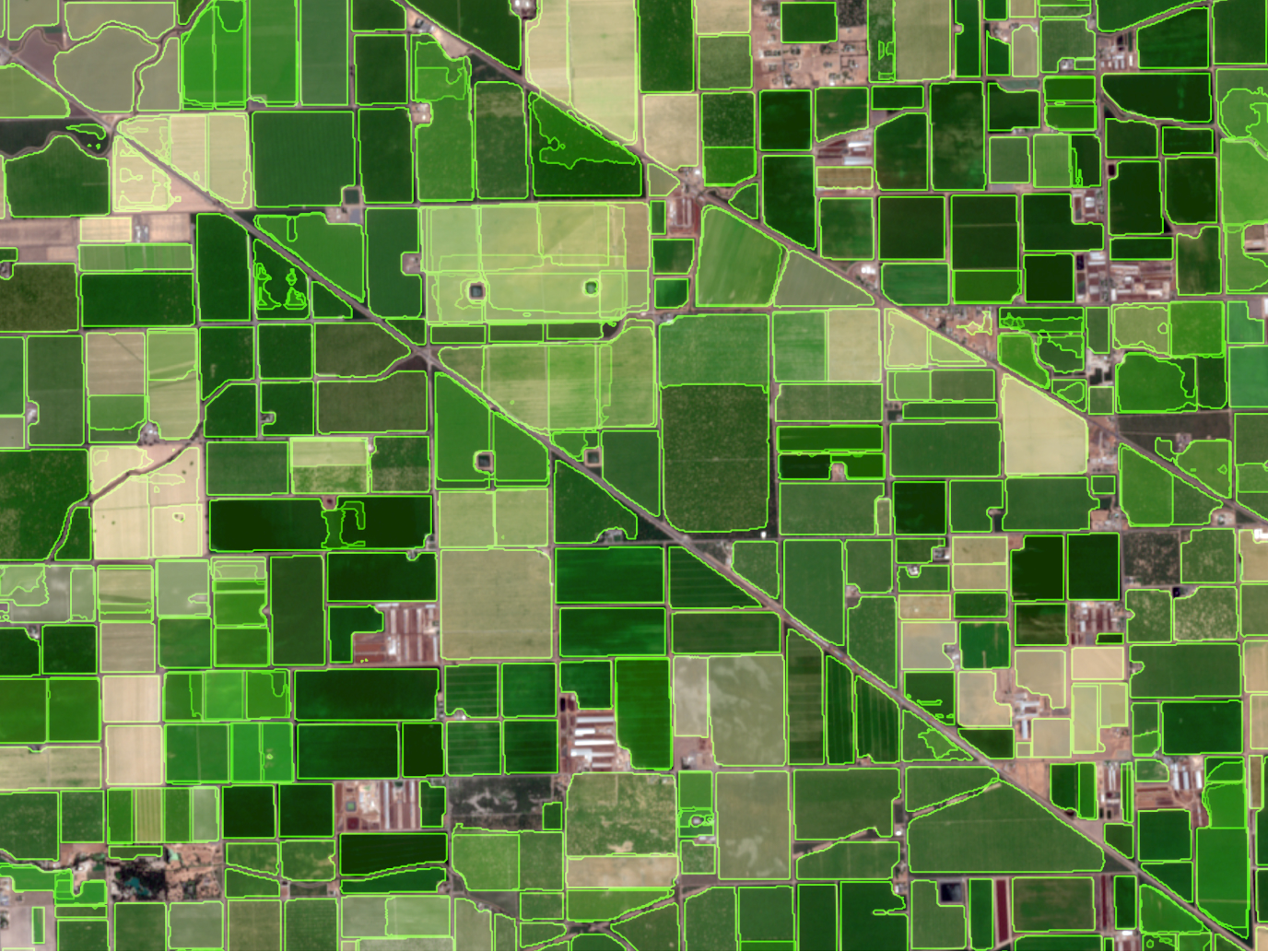Aerial grid of agricultural fields in varying green shades, representing use of pretrained deep learning models for spatial analysis