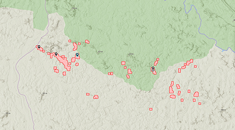 여러 빨간색 폴리곤이 전체적으로 분산된 초록색 및 베이지색 음영의 토지가 있는 맵