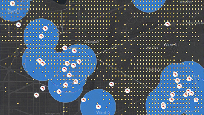 Mappa digitale nera con punti dati gialli e grandi cerchi blu