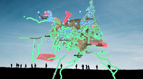 An image of a group of people walking on a path overlaid with map highlighted in green, pink, and blue