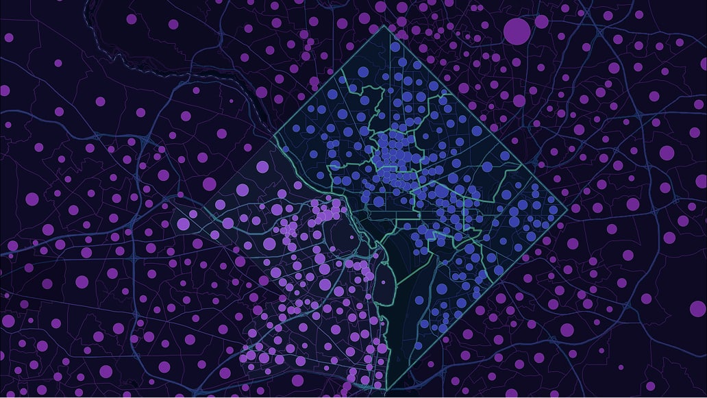 A dark map with purple points and a highlighted polygon area