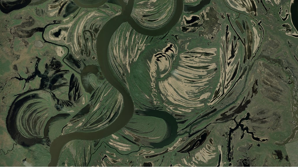 Contoured terrain with swirled elevation patterns in earth tones