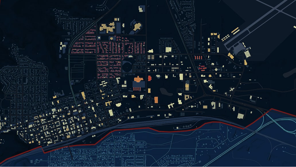A night map of a city with illuminated streets and buildings