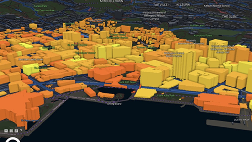 3D scene of a city with yellow and orange buildings on a terrain map