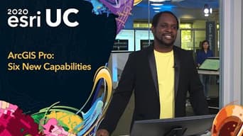 Image of a man in Esri offices next to 2020 Esri UC graphic
