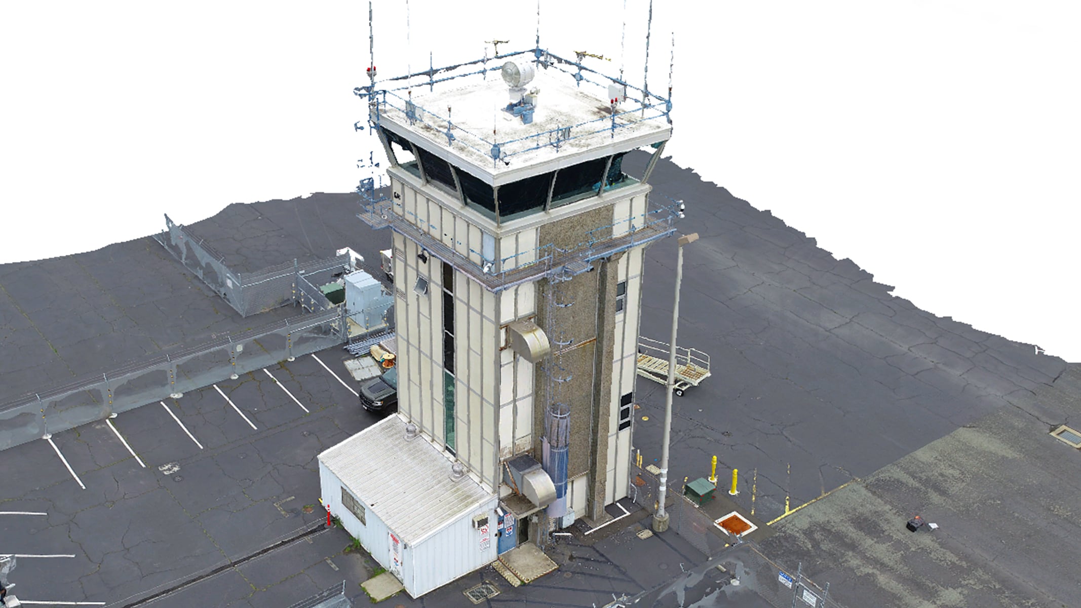 A 3D mesh of an air traffic control tower surrounded by asphalt