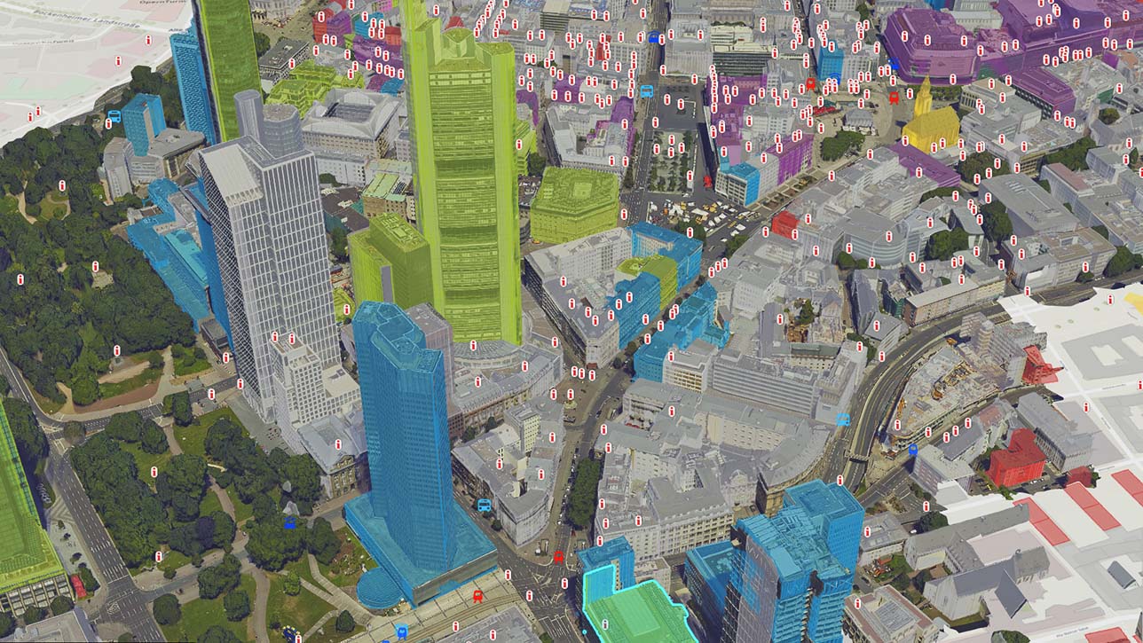 Eine bunte digitale Darstellung einer Stadt als 3D-Mesh mit Daten und Gebäuden in Grün und Blau 