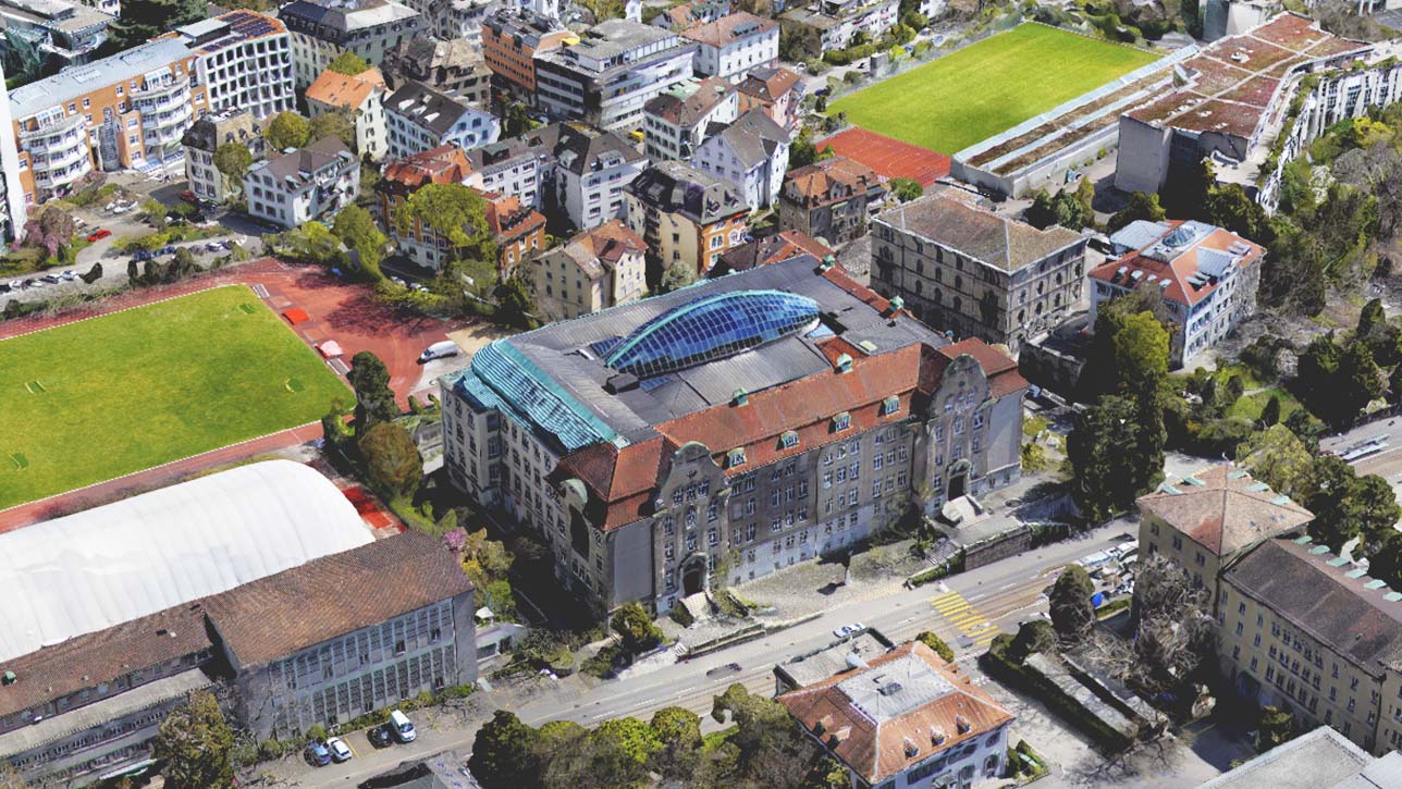 Ein Bild von einer Schulanlage mit umgebenden Gebäuden, das ein 3D-Mesh darstellt