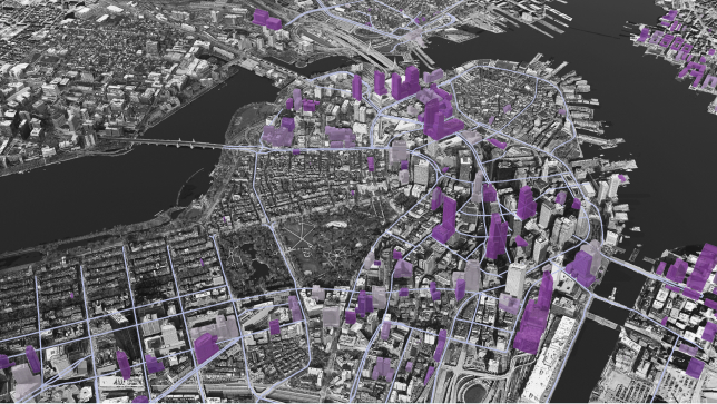 Black and white 3D imagery of a city’s roads and buildings with select building projects highlighted in purple 