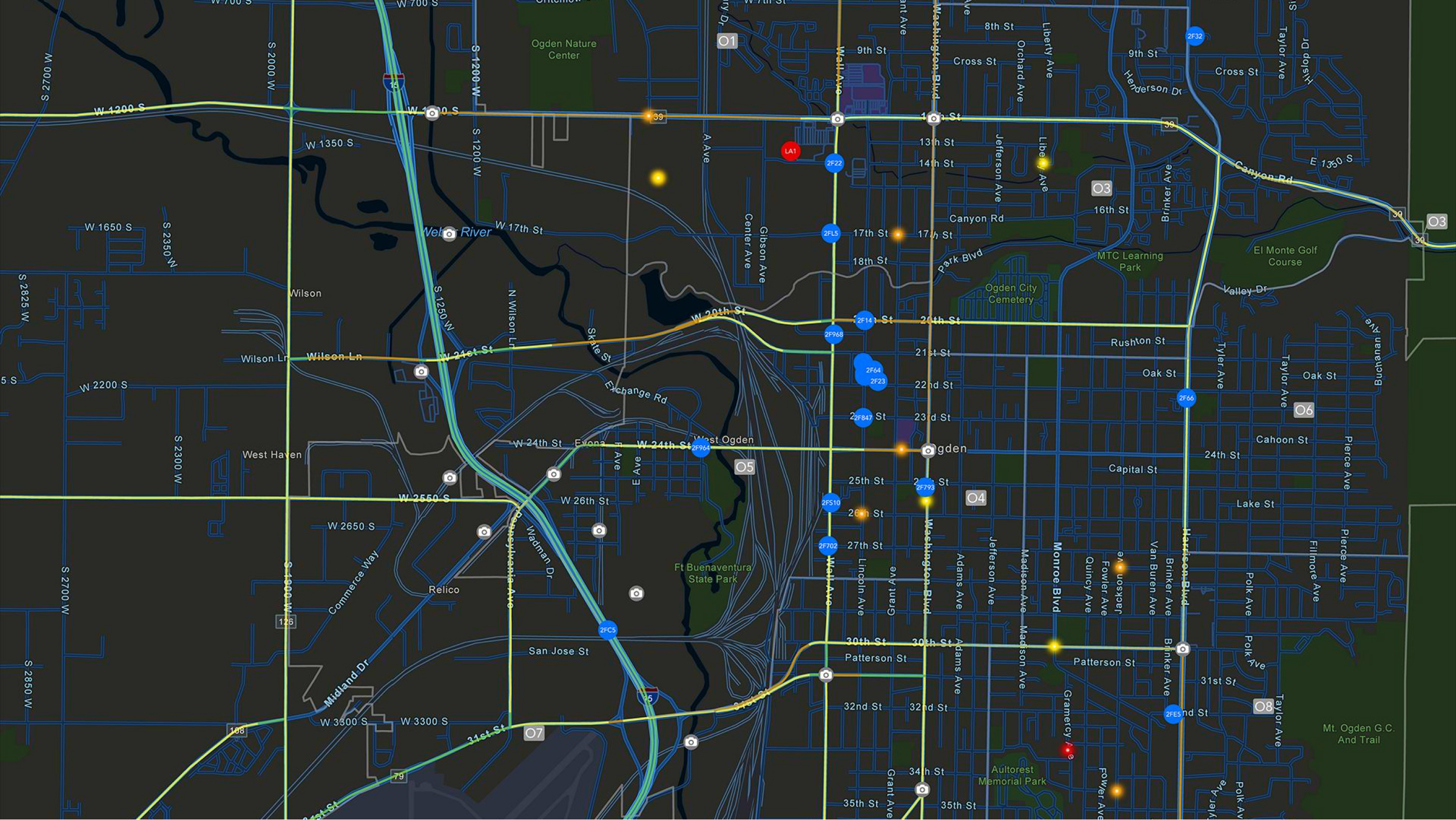 노란색으로 강조된 도시, 강, 고속도로와 흩어져 있는 여러 개의 단색 원이 표시된 검은색 맵 
