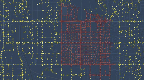 A power grid map with points of yellow and red lining the streets on a navy blue background