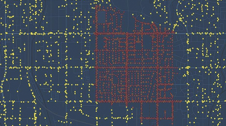 Mappa di una rete elettrica con punti gialli e rossi allineati alle strade su uno sfondo blu marina