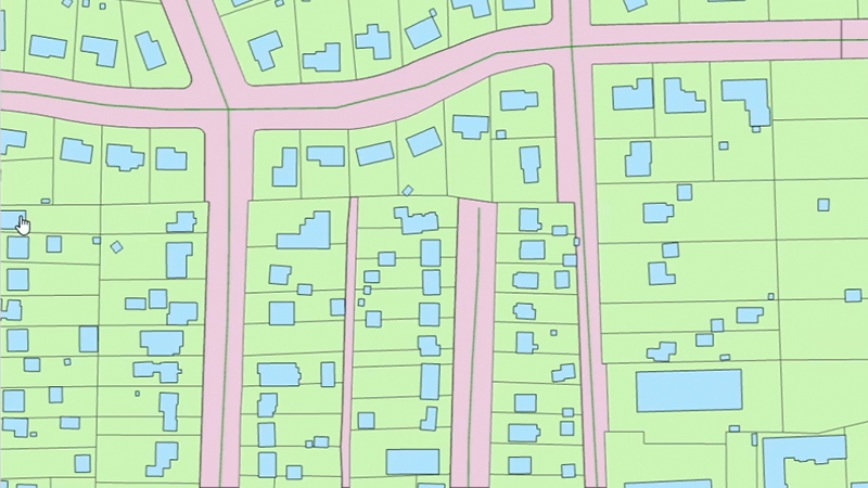 Stylized street map in pale red and blue on a light green background