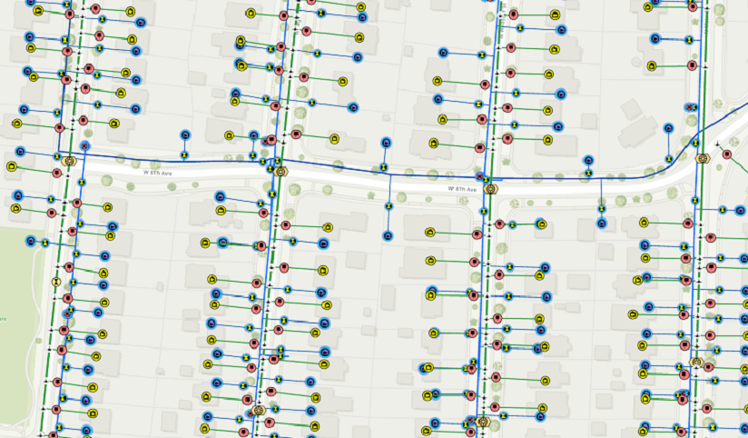 A light street map with structures represented by blue and maroon points and lines
