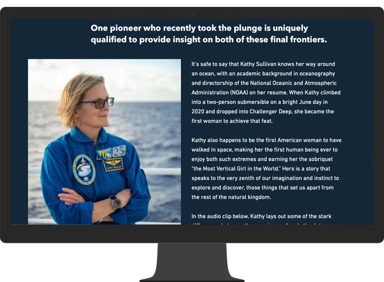 A computer monitor displaying a portrait of Kathy Sullivan and information about the Challenger Deep expedition