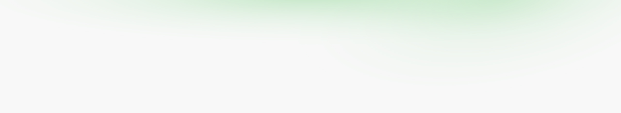 Abstract image featuring a subtle green gradient fading into white.