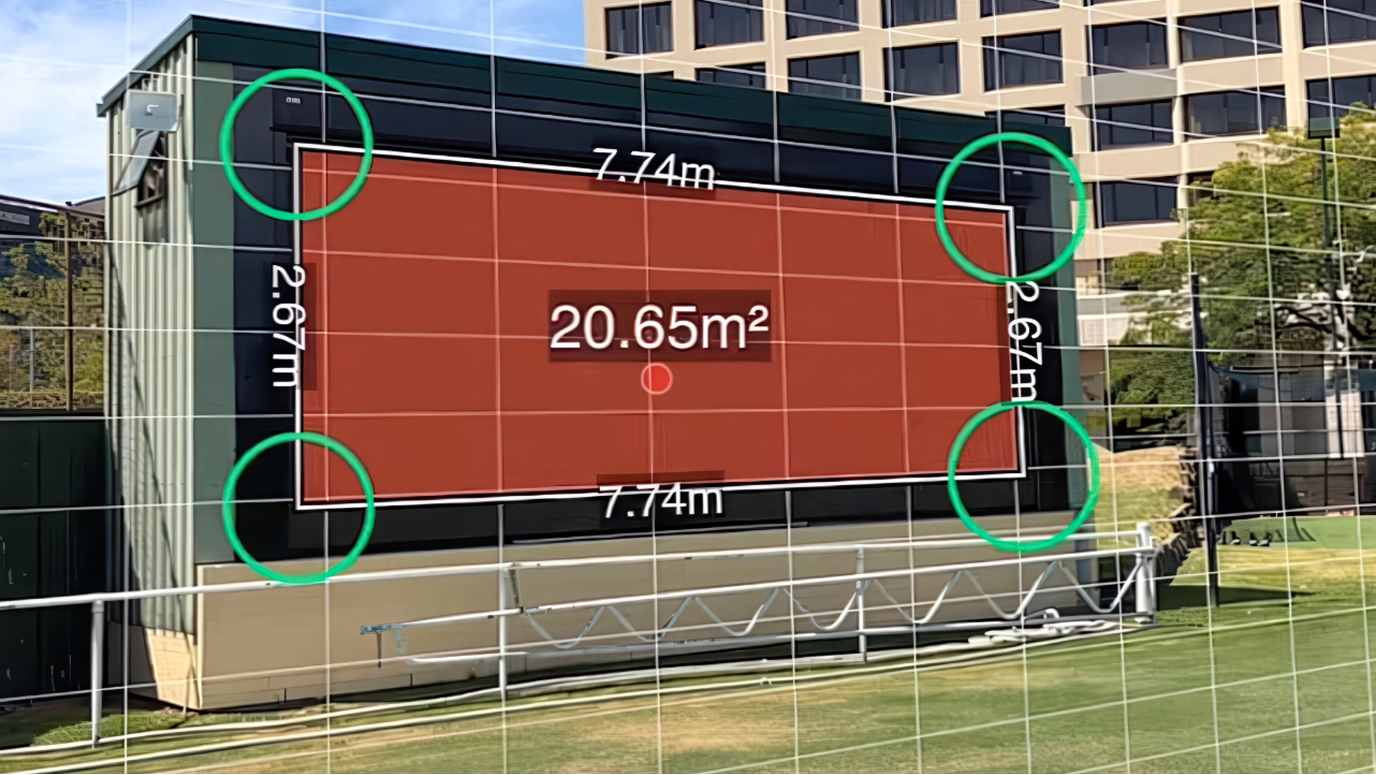 A storage building in a well-maintained park, overlaid with graphics describing the building's measurements