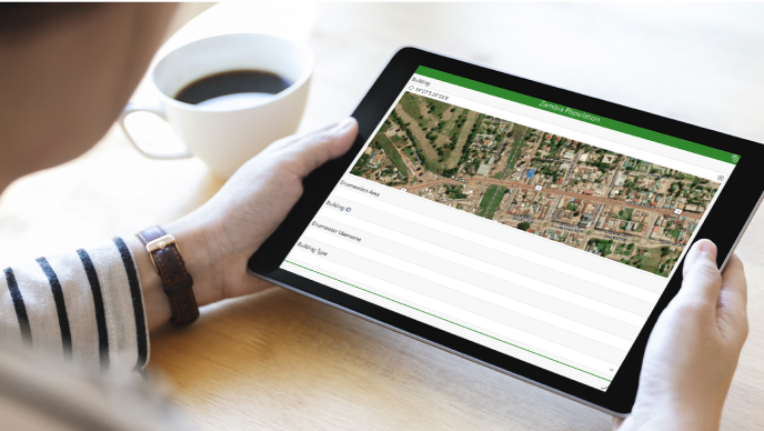 An aerial image and text representing a Survey123 population and housing census form on a tablet device