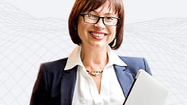 Woman in a business suit holding a tablet and smiling