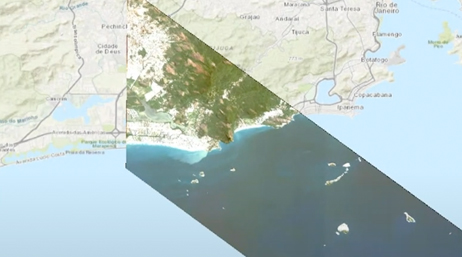 A screencap from the featured video showing a map of a coastal area in beige and pale blue, with an overlaid cutout showing the same as an aerial photo