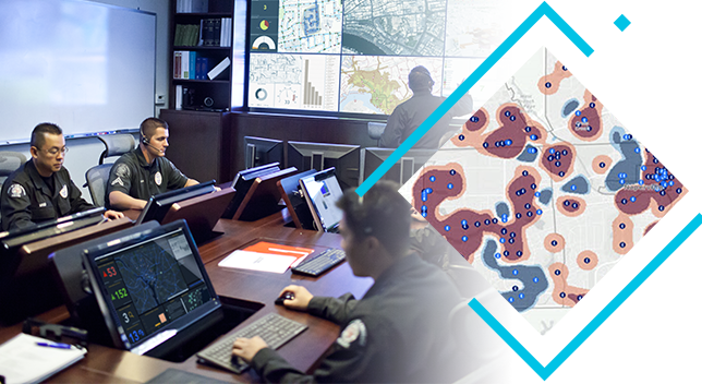 An emergency response team views maps and dashboards on monitors and a large shared screen, overlaid with a map of hot spot zones