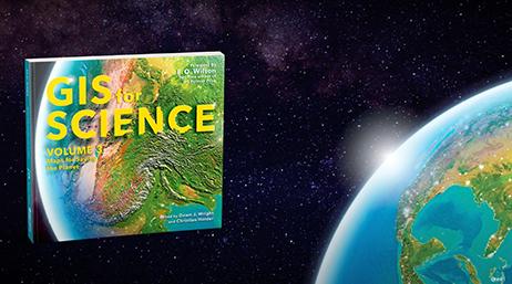 The book “GIS for Science, Volume 3” overlaid on a design of outer space and Earth