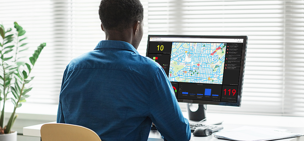 A person looking at a GIS dashboard on their computer